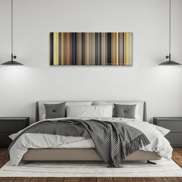 127 Hours color palette canvas above a bed, between two black pendant lamps