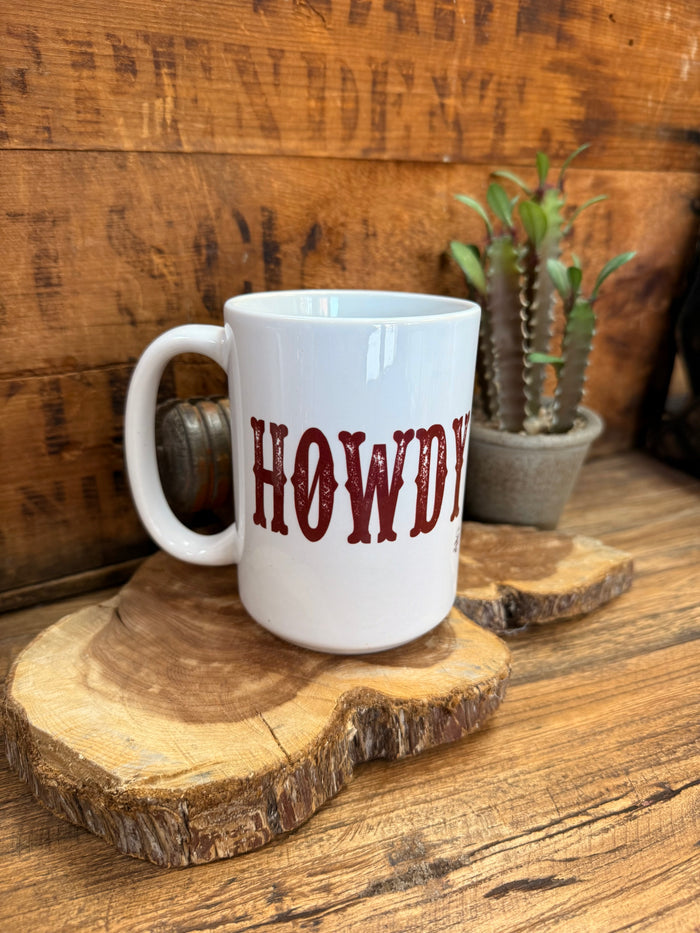 White ceramic mug with red 'HOWDY' print on front, curved handle.