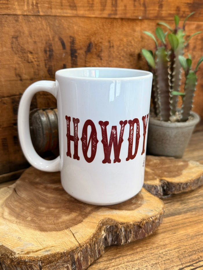 White ceramic mug with red 'HOWDY' text on front, angled view with handle.