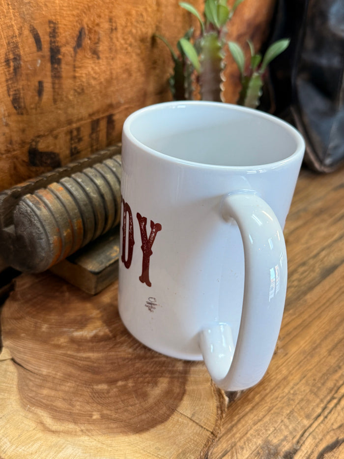 White ceramic mug with partial red 'HOWDY' print, angled with handle and rim.