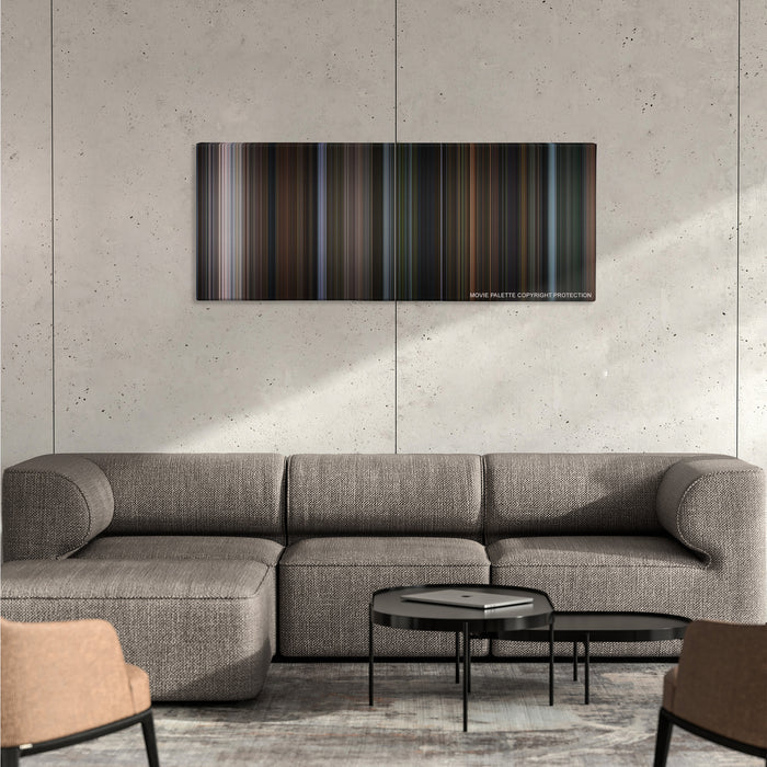 Bird Box color palette canvas on a concrete wall above a gray sectional sofa