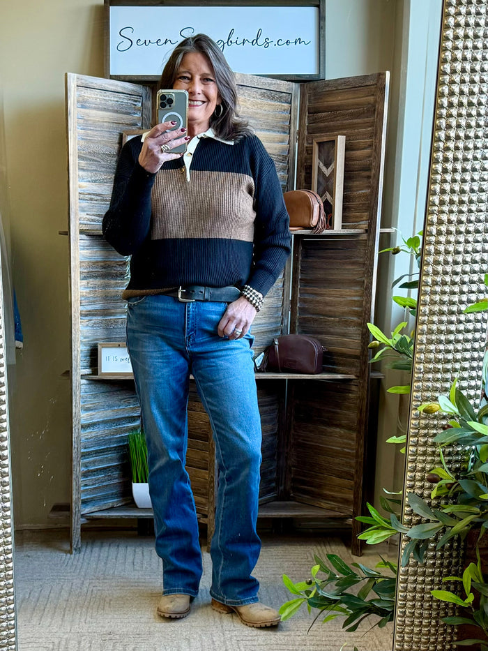 Rugby sweater with wide rust center stripe and black sleeves, ribbed hem