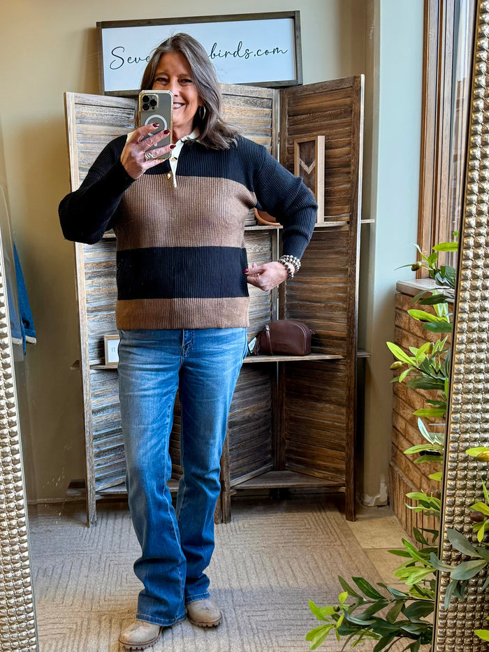 Rugby sweater with black and rust horizontal stripes, ribbed collar and cuffs