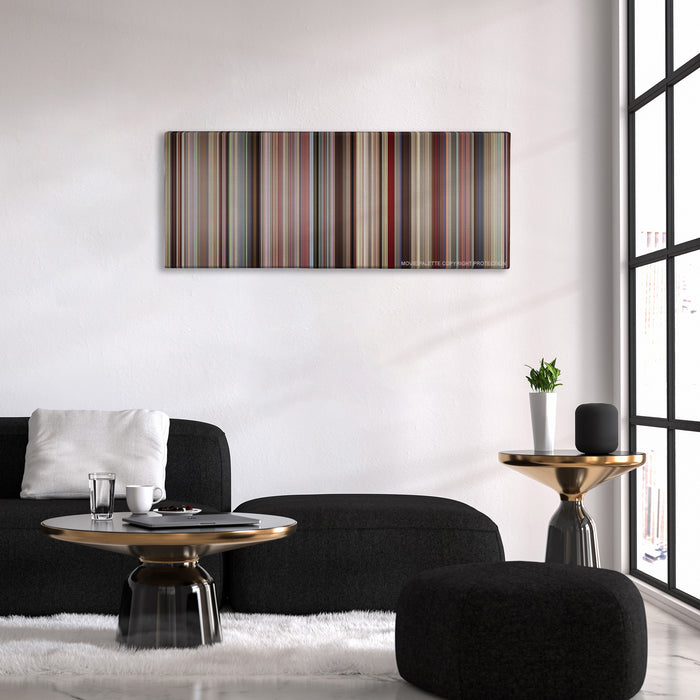 Boyhood color palette canvas above a black sofa with a gold-topped table