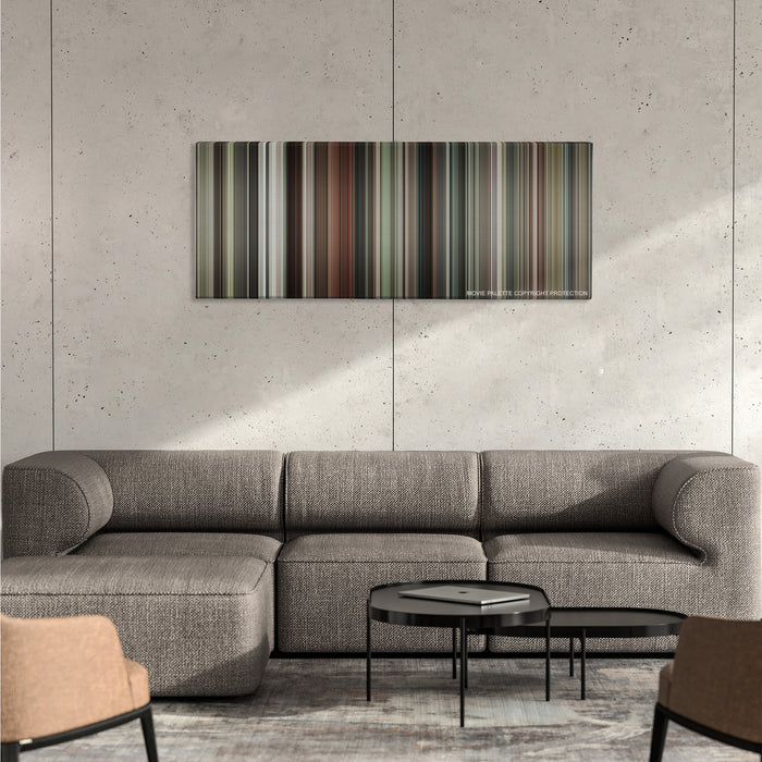 Burn After Reading color palette canvas on a concrete wall above a gray sectional sofa