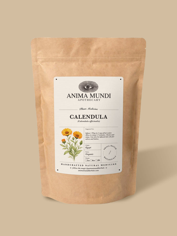 A kraft paper stand-up pouch of Anima Mundi Apothecary Calendula herbal medicine, featuring a white label with botanical illustrations, set against a solid beige background.