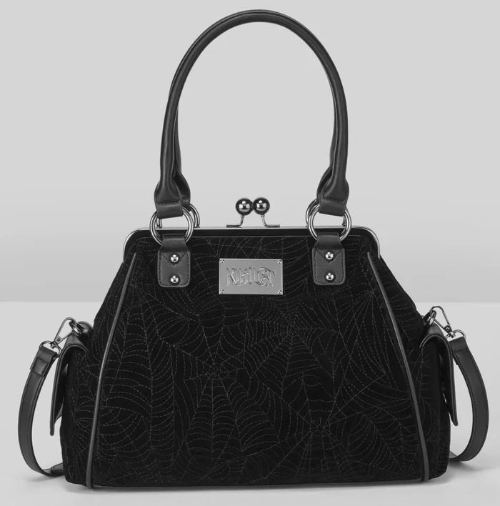 Black textured handbag with silver hardware on a light gray background