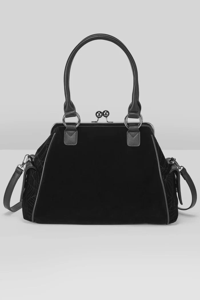 Black handbag with a strap on a light gray background