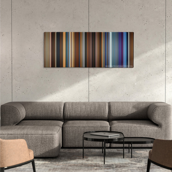 Click color palette canvas on a concrete wall above a gray sectional sofa