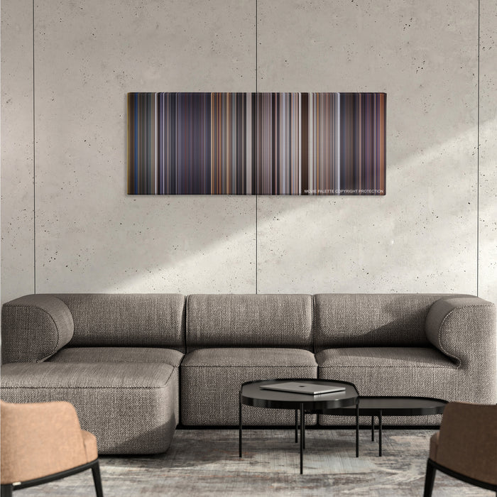 Con Air color palette canvas on a concrete wall above a gray sectional sofa
