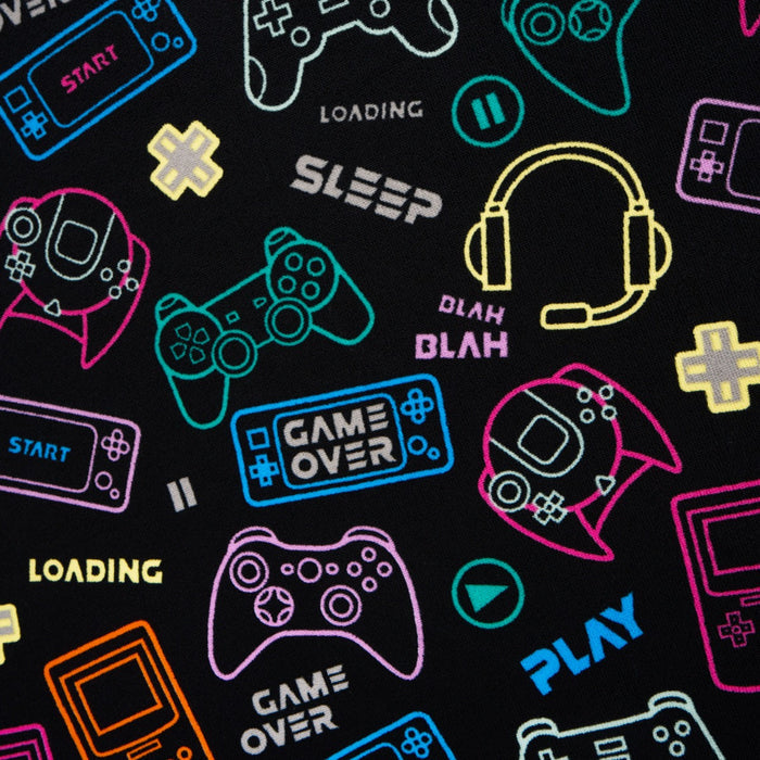 Close-up view of gaming-themed pattern on black microfibre beach towel for kids