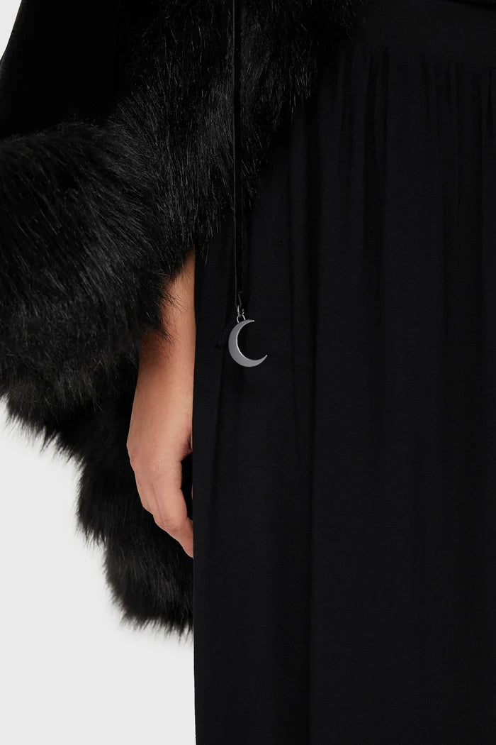 Black faux fur-trimmed coat with a silver moon pendant on a white background