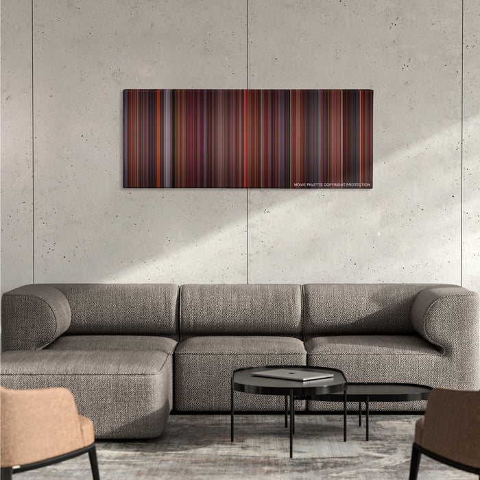 Die Hard 2 color palette canvas on a concrete wall above a gray sectional sofa