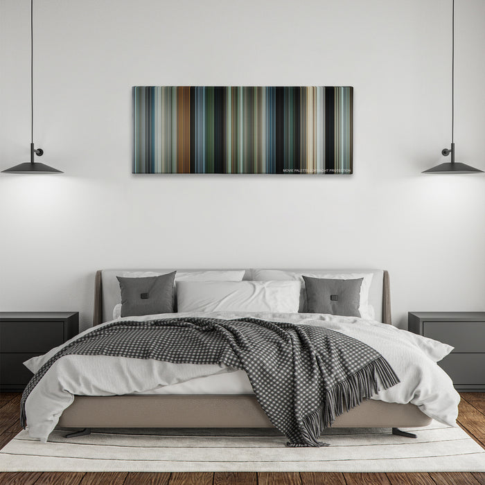 Due Date color palette canvas above a bed, between two black pendant lamps