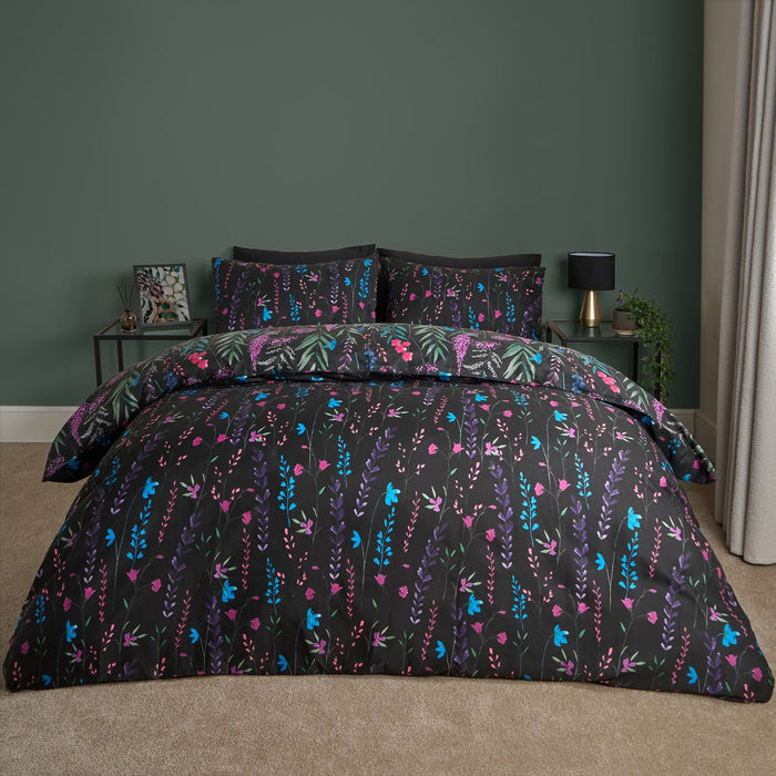 Super king black floral duvet cover set styled on bed with matching pillowcases