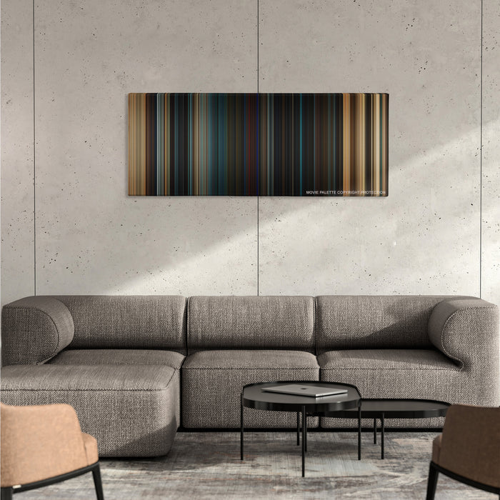 Fast & Furious color palette canvas on a concrete wall above a gray sectional sofa