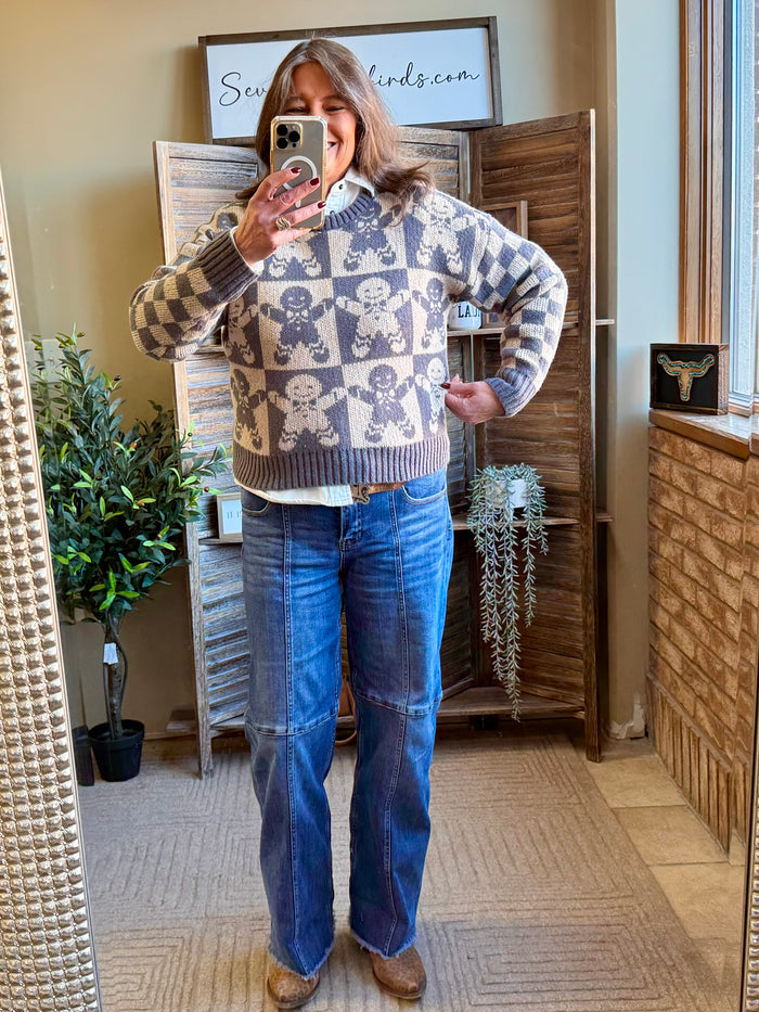 Checkerboard graphic sweater in cream and dark navy with gingerbread icons