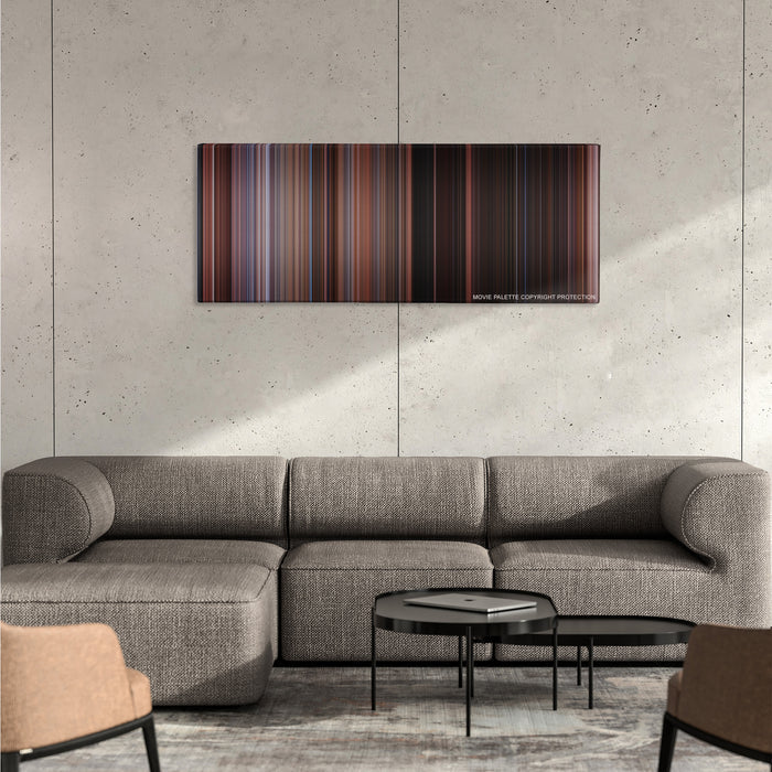Home Alone 2: Lost in New York color palette canvas on a concrete wall above a gray sectional sofa