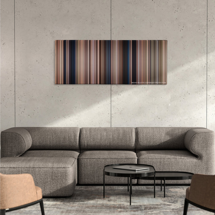 Hotel Rwanda color palette canvas on a concrete wall above a gray sectional sofa