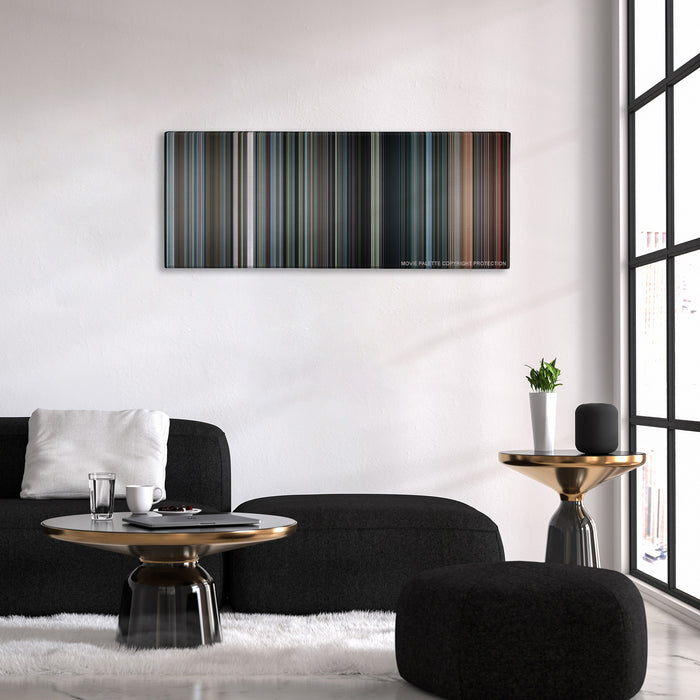 Inside Man color palette canvas above a black sofa with a gold-topped table