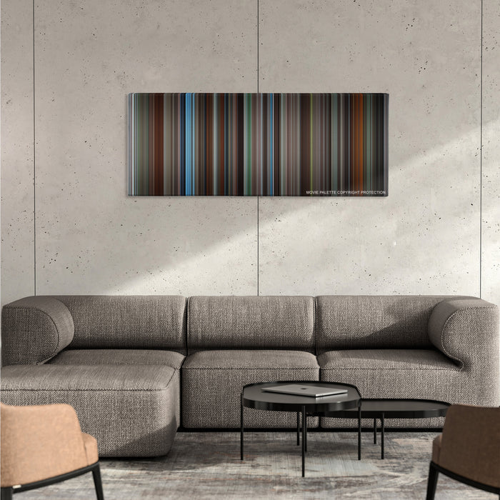 Insomnia color palette canvas on a concrete wall above a gray sectional sofa