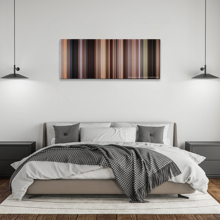 Jackie Brown color palette canvas above a bed, between two black pendant lamps
