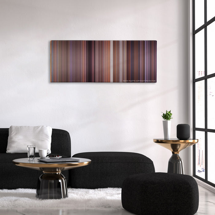 Meet the Parents color palette canvas above a black sofa with a gold-topped table