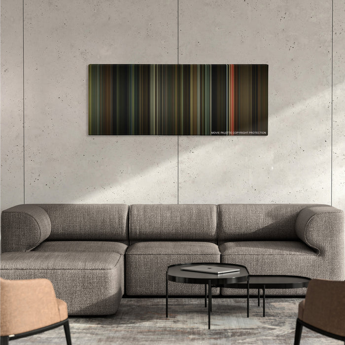 Moon color palette canvas on a concrete wall above a gray sectional sofa
