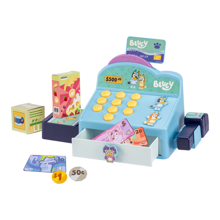 The Moose Toys Bluey Cash Register by Moose Toys features themed decorations, play money, coins, credit cards, and cardboard groceries for pretend shopping role play—all displayed on a white background.