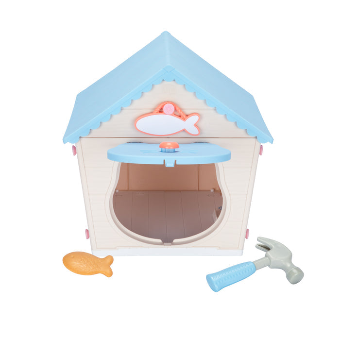 The Moose Toys Little Live Pets My Kitty's Home from Moose Toys features a blue-roofed playset with fish decor, an open front, and comes with a toy fish and hammer—perfect for imaginative fun.