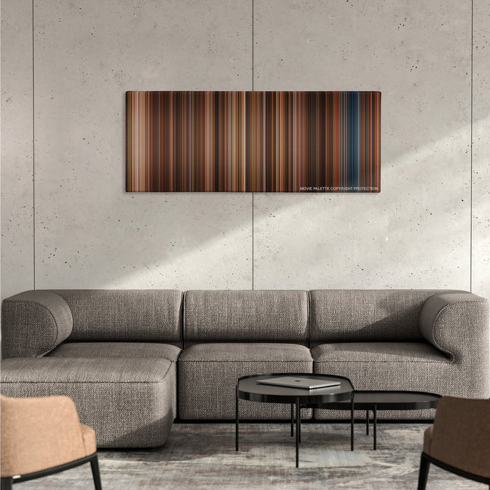 Night at the Museum color palette canvas on a concrete wall above a gray sectional sofa