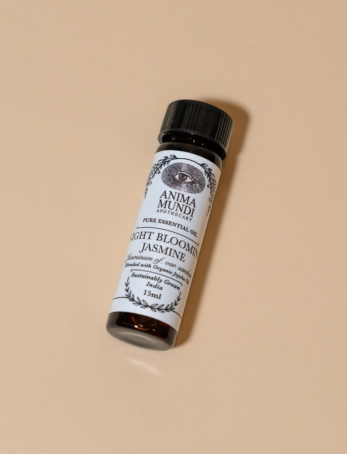 Anima Mundi essential oil bottle on a beige background