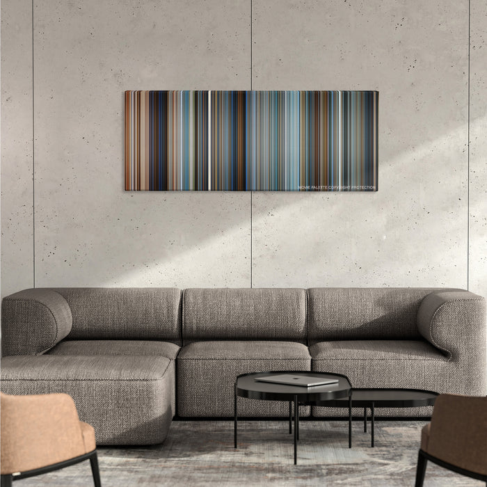 Pearl Harbor color palette canvas on a concrete wall above a gray sectional sofa