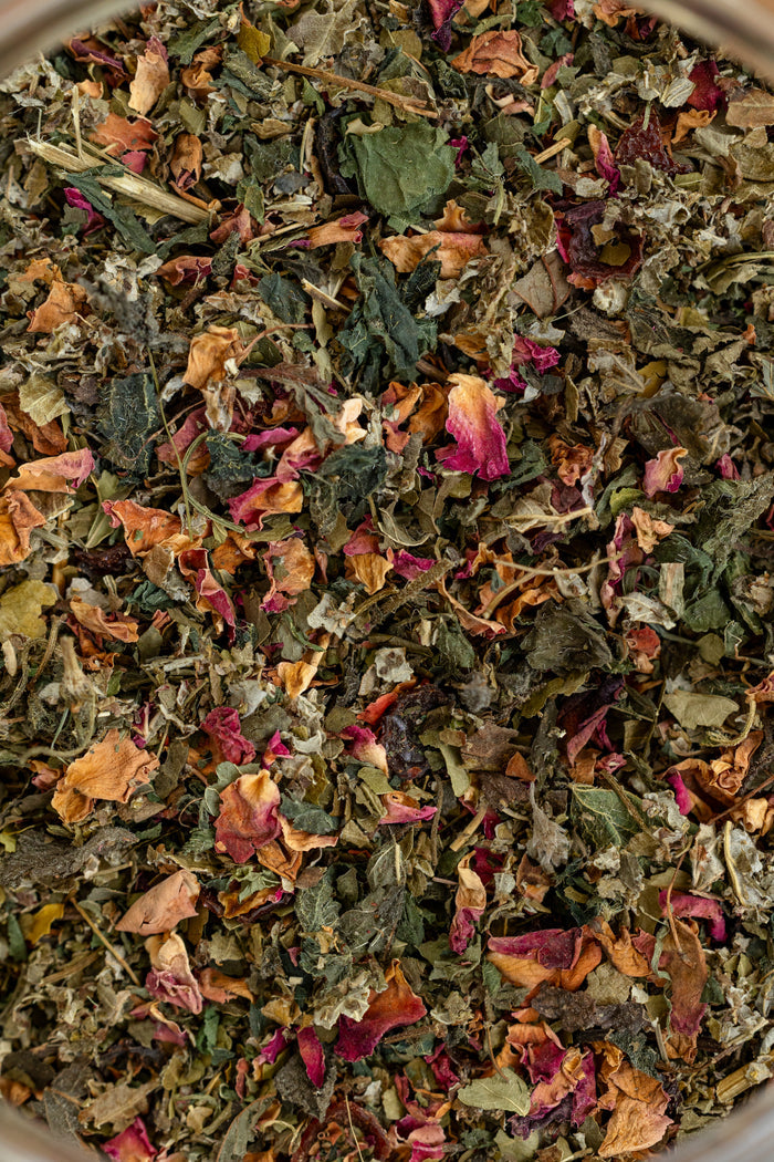 Close-up of a mix of dried herbs and flowers in a bowl
