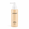 pressed leave-in scalp spray 120ml bottle with white pump on a white background