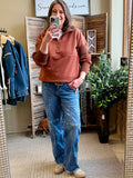 Rust quarter-zip pullover shirt with front zip and relaxed fit, long sleeves
