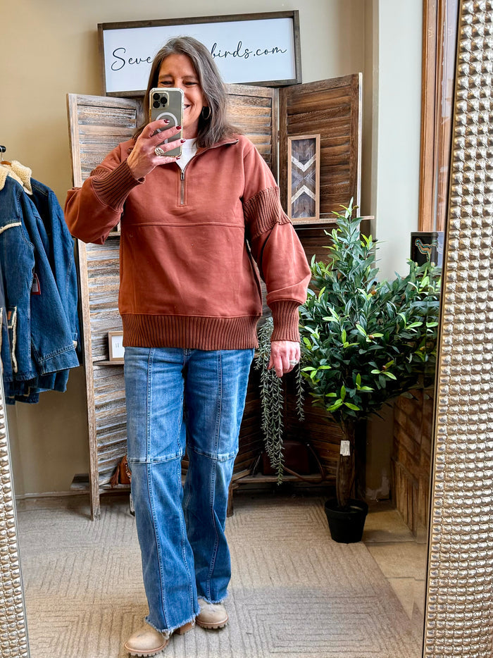 Rust quarter-zip pullover shirt with ribbed cuffs and hem, long sleeves