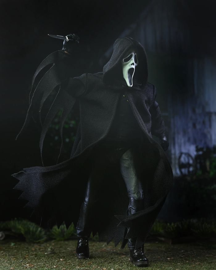 Toy in a dark costume with a mask in a dark, eerie setting