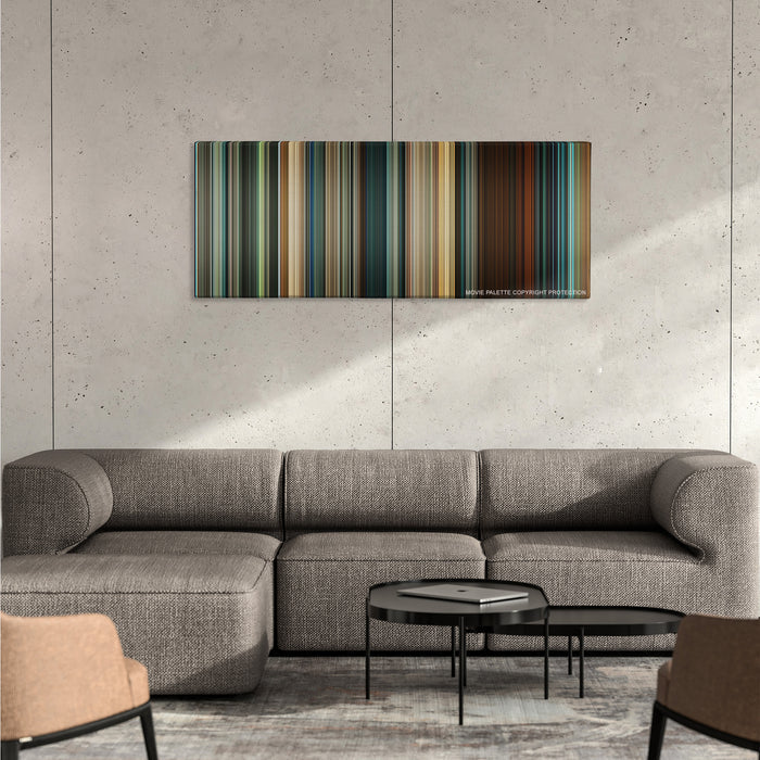 Seven Pounds color palette canvas on a concrete wall above a gray sectional sofa