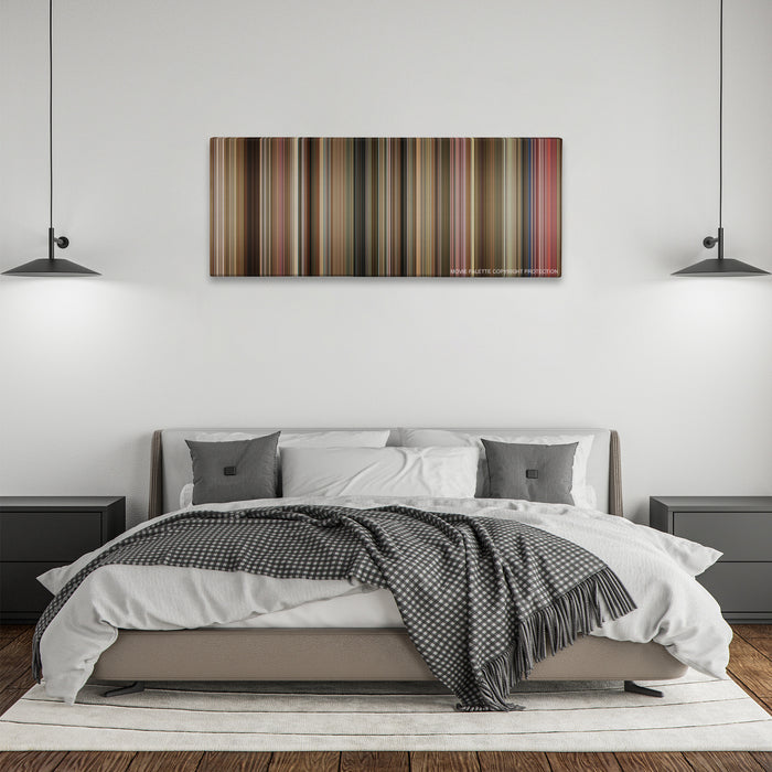 The Fighter color palette canvas above a bed, between two black pendant lamps