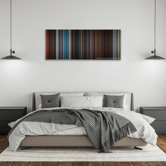 The Interview color palette canvas above a bed, between two black pendant lamps