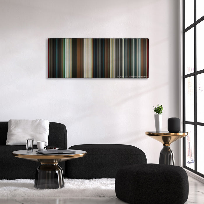 The Man from U.N.C.L.E. color palette canvas above a black sofa with a gold-topped table