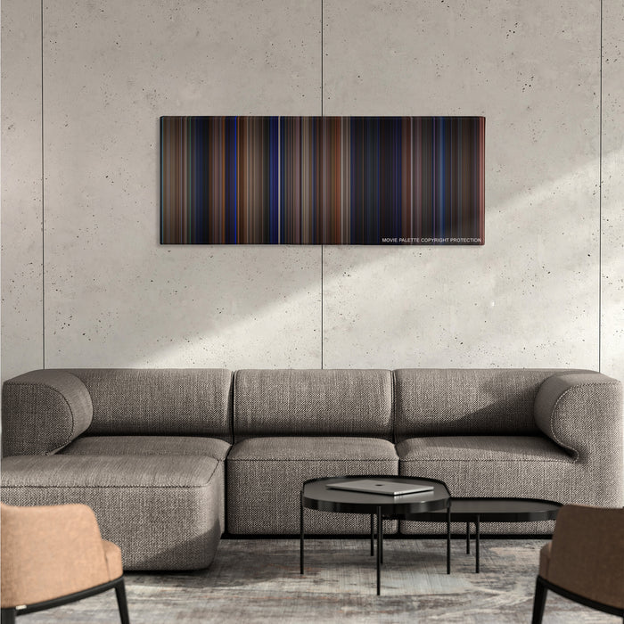 The Mask color palette canvas on a concrete wall above a gray sectional sofa