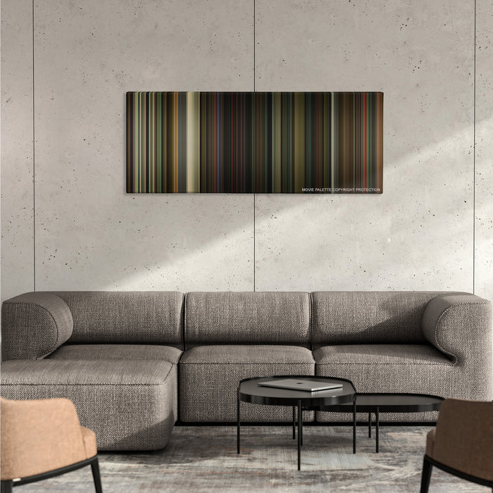 The Nice Guys color palette canvas on a concrete wall above a gray sectional sofa