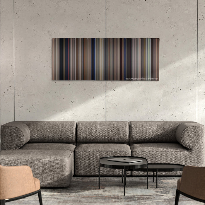 The Untouchables color palette canvas on a concrete wall above a gray sectional sofa