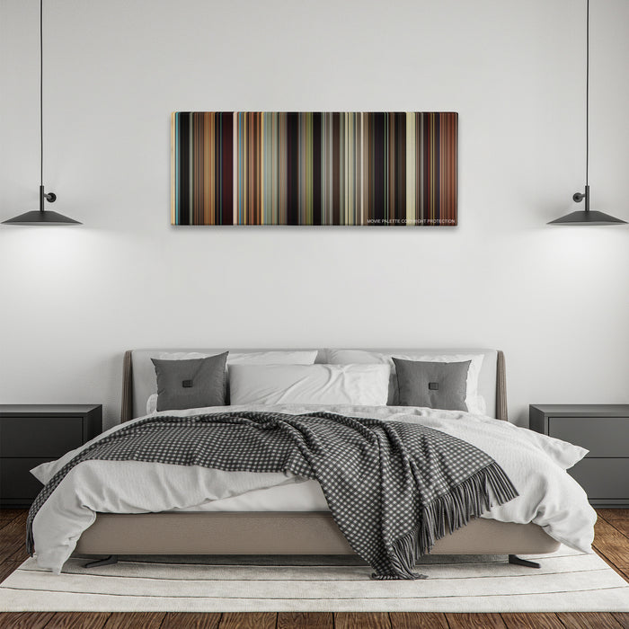 The Wrestler color palette canvas above a bed, between two black pendant lamps