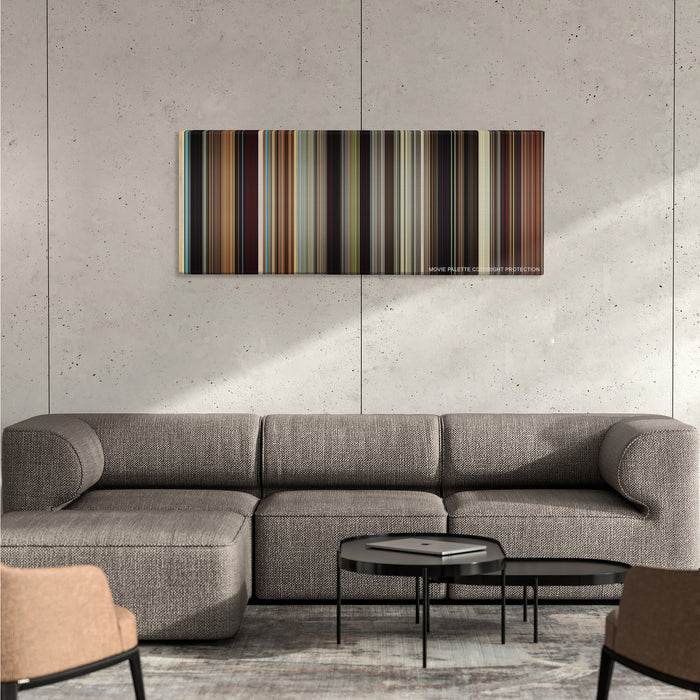 The Wrestler color palette canvas on a concrete wall above a gray sectional sofa
