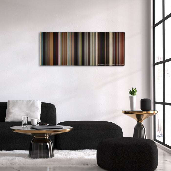 The Wrestler color palette canvas above a black sofa with a gold-topped table