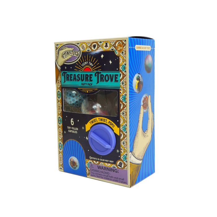 Tiny Toys Teeny Tiny Treasure Trove by Tiny Toys features six surprise capsules in a mini gashapon-style box with a blue turning knob and hand-with-capsule illustration. Colorful packaging. For ages 3+.
