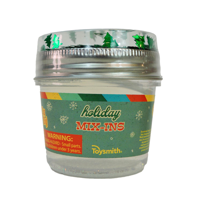 The Toysmith Deluxe Holiday Mix-In Slime features a clear plastic container with colorful stripes, snowflakes, green Christmas tree lid, and front warning label—perfect as a Christmas slime gift or for sensory play.